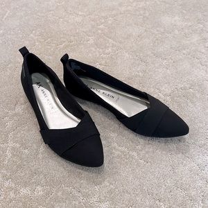 New, never worn! Black flats with pointed toe, size 8.5. Bottoms are non slip.